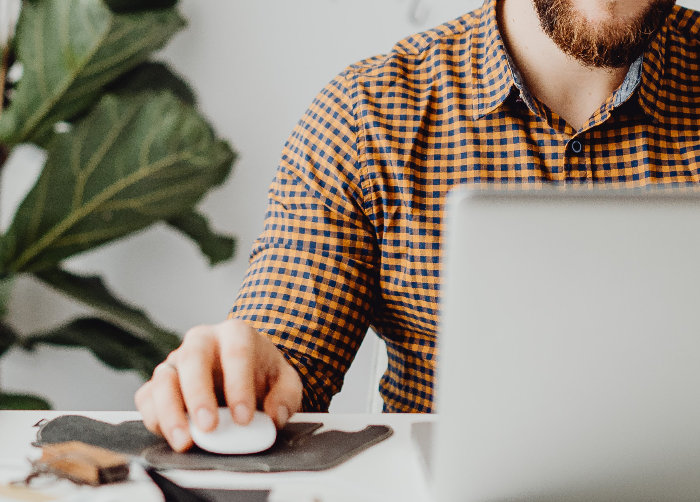 A photo of a man using his laptop computer